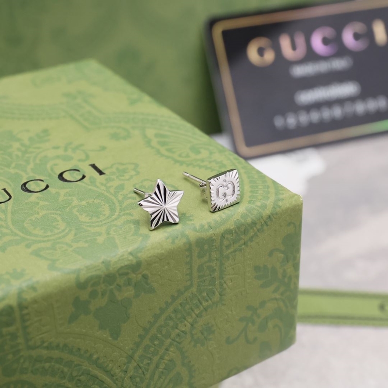 G*u*i earrings